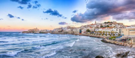 Photo for Breathtaking view of historic center and promenade of the city of Vieste at sunset. View at the coast of Vieste on Puglia, Italy, Europe - Royalty Free Image