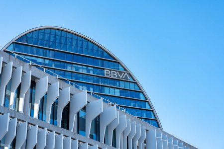 Téléchargez les photos : Madrid, Spain, February 4, 2023: BBVA bank headquarters in Madrid on a clear day and blue sky, copyspace - en image libre de droit