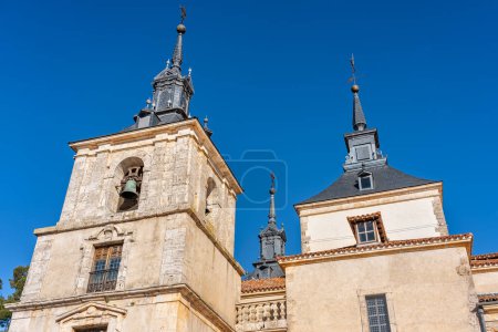 Photo for Church towers and monumental palace in the tourist town of Nuevo Baztan next to Madrid, Spain - Royalty Free Image