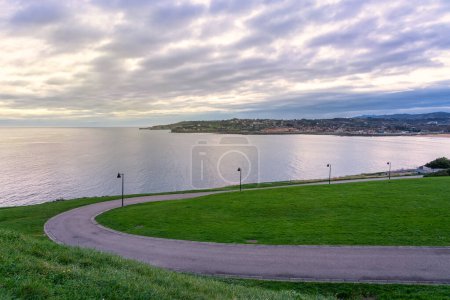 Photo for Sunrise in the cove of San Lorenzo beach in the city of Gijon, Asturias - Royalty Free Image
