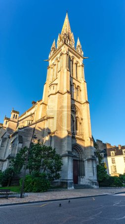 Photo for Huge tower of the medieval church of St. Martin in the center of the tourist city of Pau, France - Royalty Free Image
