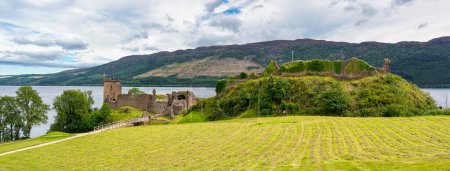 Photo for Panoramic view of the ruins of Urquhart Castle on the shore of massive Loch Ness, Scotland, UK. - Royalty Free Image