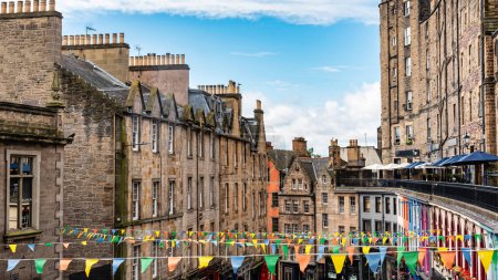 Photo for Victoria Street in downtown Edinburgh decorated with flags for the August party, Scotland - Royalty Free Image