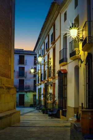 Photo for Quaint narrow alley at dusk in the Andalusian village of Velez Rubio, Almeria, Spain - Royalty Free Image