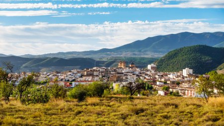 Photo for Panoramic view of the Andalusian white village next to the high mountains that surround it, Velez Rubio, Almeria - Royalty Free Image