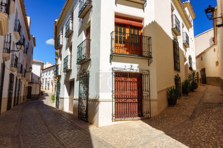 Photo for Picturesque streets with whitewashed houses and barred windows in the Andalusian village of Velez Rubio - Royalty Free Image