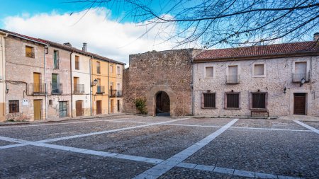 Photo for Old houses in the large square of the picturesque village of Palazuelos, Guadalajara, Spain. - Royalty Free Image