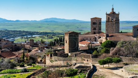 Medieval churches and towers with mountainous landscape in the background in the Unesco city of Trujillo, Spain.