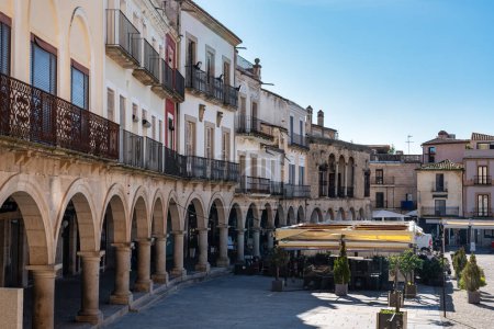 Old houses with stone arcades in the main square of the city of Trujillo, Spain
