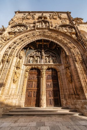 Medieval church facade highly decorated with stone carvings in Aranda de Duero, Burgos