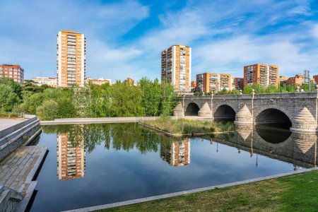Photo for Skyline of the city of Madrid next to the bridge that crosses the Manzanares River to the south of the city - Royalty Free Image