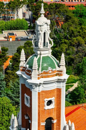 Tower of an old church in the city of Madrid next to the entrance of the Moncloa to the city