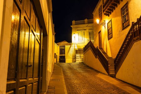 Picturesque streets with white colonial-style buildings at night lit up with street lamps, Santa Cruz, La Palma
