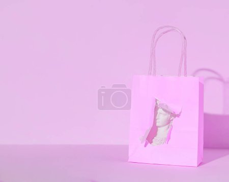 Popular souvenir in a shopping bag, travel concept, pastel background, holiday in Italy.