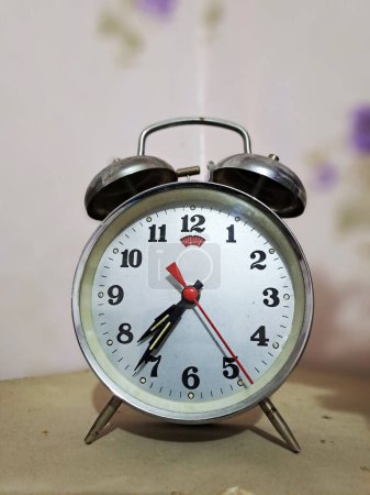 Photo for Alarm clock on the table - Royalty Free Image