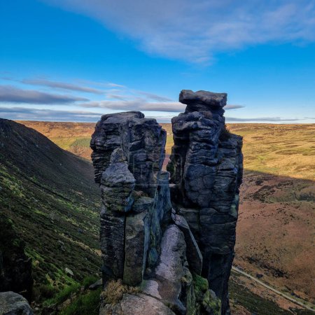 Photo for This inspiring collection encapsulates a full day's journey along the Dove Stone trail, near Oldham, with breathtaking views of the Trinnacle in the Peak District. From the first golden rays of dawn that grace the horizon to the tranquil reflections - Royalty Free Image