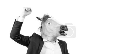 Foto de Hombre de negocios con mascarilla de caballo con puño levantado gesto de fuerza aislado en el espacio de copia blanca, caballo de batalla. - Imagen libre de derechos