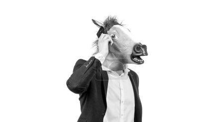 Foto de Hombre trabajador en la cabeza de caballo hablar en el teléfono móvil aislado en blanco, comunicación de negocios. - Imagen libre de derechos