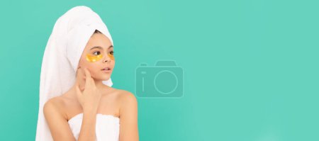 Photo for Kids facial treatment, cosmetology and spa, teen girl in shower towel with golden patch. Cosmetics and skin care for teenager child, poster design. Beauty kid girl banner with copy space - Royalty Free Image