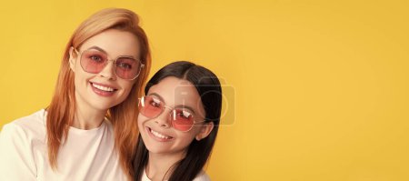 Photo for Mother and daughter child banner, copy space, isolated background. happy family portrait of single woman mother and kid in glasses, friendship - Royalty Free Image