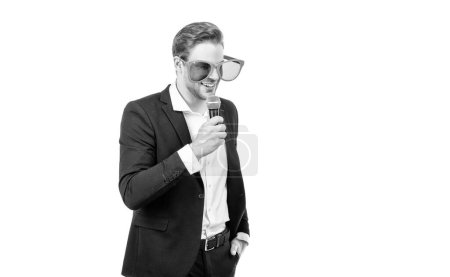 Photo for Speaking in public. Speaker in funny glasses speak to microphone. Business speaker isolated on white. Professional showman. Conferencier, copy space. - Royalty Free Image