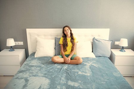 Photo for Teenager child girl resting in bed at home bedroom - Royalty Free Image