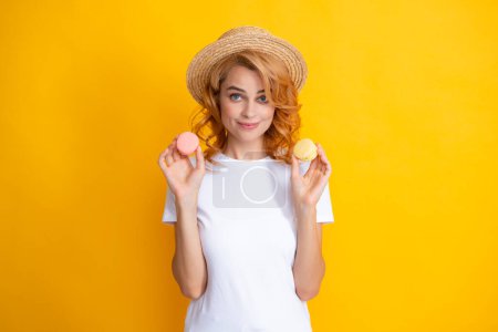 Photo for Portrait of stylish beautiful pretty cute she her girl with sweets cookies macaroon isolated on yellow background - Royalty Free Image