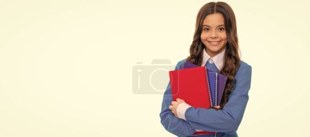Photo for Happy face of teen girl with long curly hair hold school workbook isolated on white, school. Banner of schoolgirl student. School child pupil portrait with copy space - Royalty Free Image