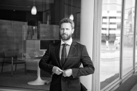 Photo for Serious bearded man boss in businesslike suit outside the office, business executive. - Royalty Free Image