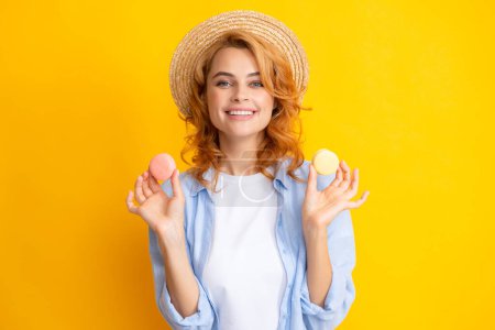 Photo for Charming woman want to bite tasty macaron, holding macaroon near open mouth, beauty girl enjoying sweets - Royalty Free Image