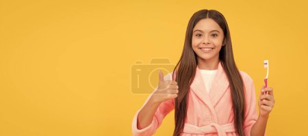 Oral care. self hygiene. daily habit. happy teen girl hold toothbrush. childhood happiness. Banner of child girl with teeth brush, studio portrait, header with copy space