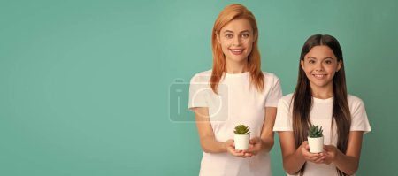 Photo for Mother and daughter child banner, copy space, isolated background. Family care. Mother and daughter child hold houseplants. Happy family. Childhood and parenting - Royalty Free Image