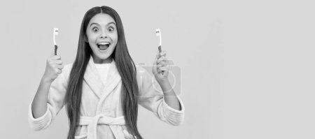 Photo for Morning routine. kid wear soft night suit. child in cozy sleepwear brush teeth. Banner of child girl with teeth brush, studio portrait, header with copy space - Royalty Free Image