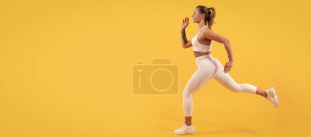 active sport woman runner running on yellow background. Woman jumping running banner with mock up copyspace