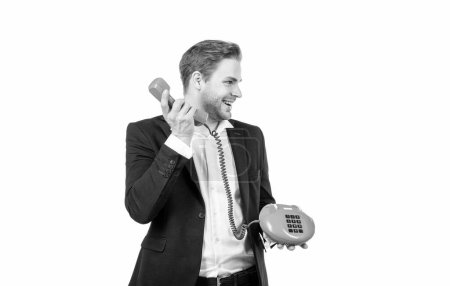 Happy manager picked up vintage telephone receiver holding old-fashioned landline phone isolated on white copy space, call.