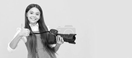 the best. childhood. teen girl taking photo. kid use digital camera. happy child photographing. Child photographer with camera, horizontal poster, banner with copy space