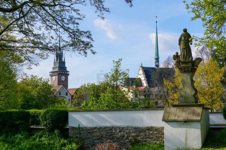 Historical Green Gate and church in the city of Pardubice in the Czech Republic (Europe) on spring day