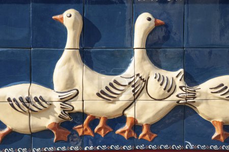 Photo for Soufflenheim, France - May 05, 2022: Detail of a house facade with geese as motif worked on ceramic tiles in Soufflenheim. Bas-Rhin department in Alsace region of France - Royalty Free Image
