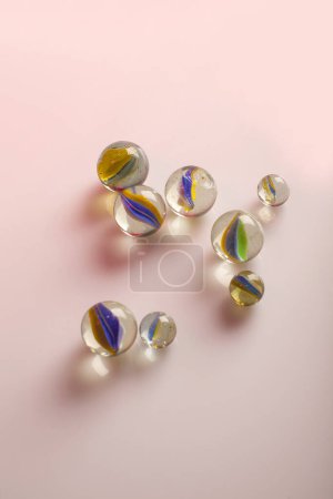 Photo for Glass marbles isolated on pink background - Royalty Free Image