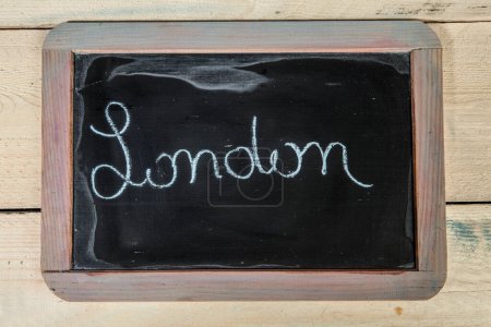Photo for The word "London " written in white chalk on a blackboard - Royalty Free Image