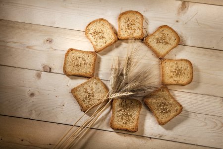 Photo for Rusks, wheat and ears on a table - Royalty Free Image