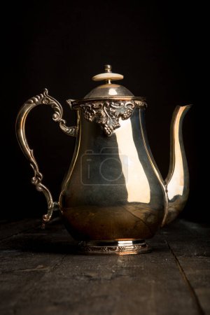 Photo for Golden teapot on a dark background - Royalty Free Image