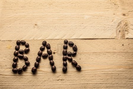 Photo for Written "bar" on wooden boards with coffee beans - Royalty Free Image