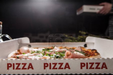 Photo for 3 red writings Pizza in take-away cardboard with stuffed pizza inside - Royalty Free Image