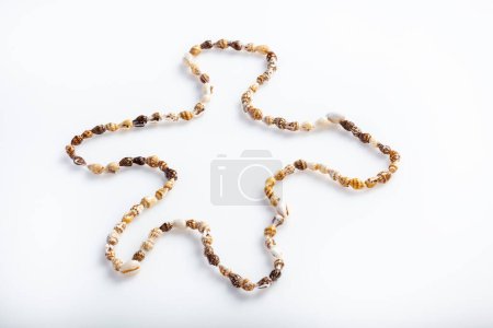 Photo for Necklace describing the human form isolated on a white background - Royalty Free Image