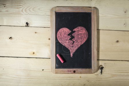 Photo for Chalkboard with broken heart drawing - Royalty Free Image