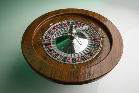 Photo for Wooden roulette isolated on green background - Royalty Free Image