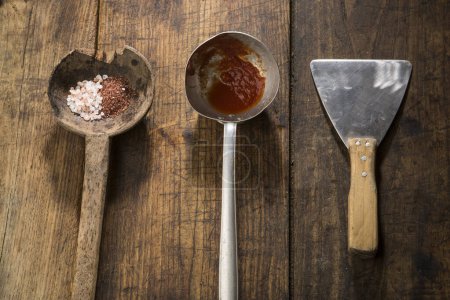 Photo for Various vintage tools with colored salt above, isolated on wood background - Royalty Free Image