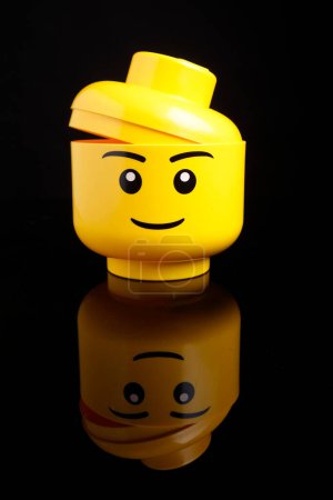 Photo for Cagliari, Italy - 12 January 2011: lego container in the shape of a face, isolated on black background - Royalty Free Image