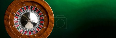 Photo for Wooden roulette isolated on green background - Royalty Free Image